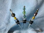 three beaded wine stoppers
